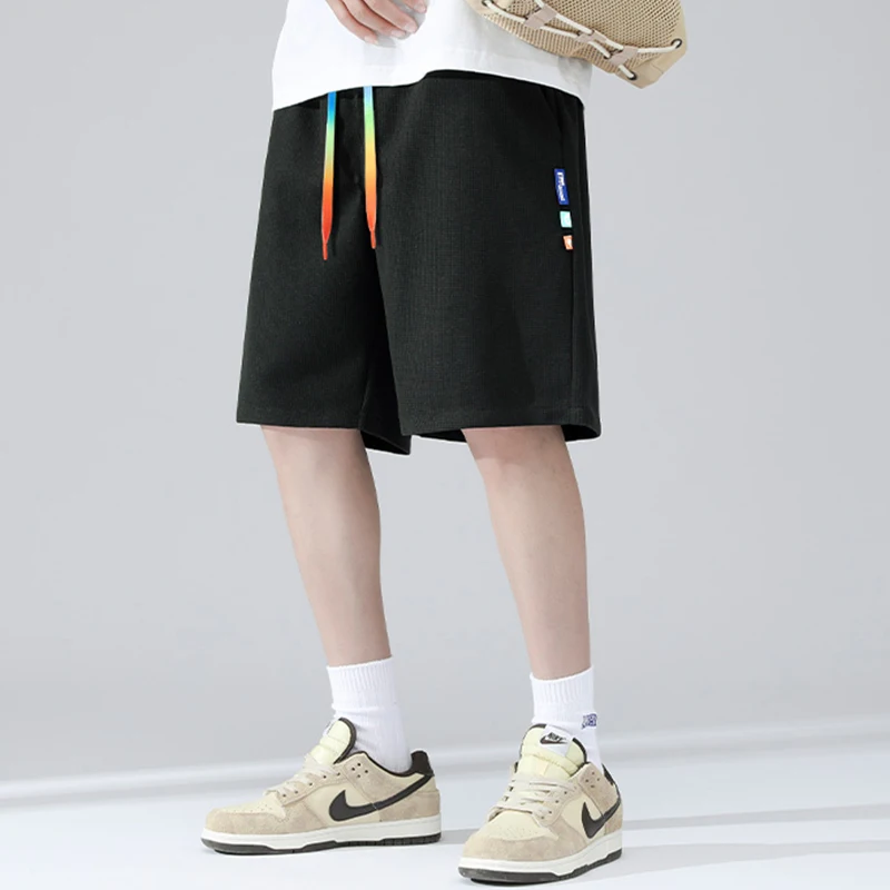 

Новые летние спортивные повседневные шорты мужские свободного кроя больших размеров 4XL, тонкие бриджи средней длины, удобные легкие вафельные мужские шорты