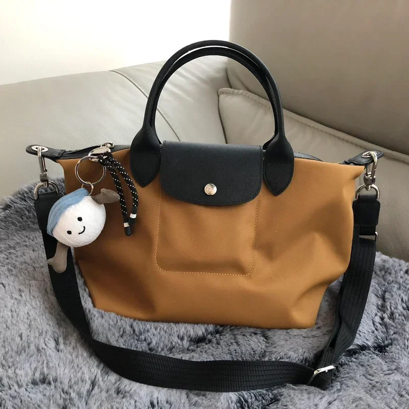 Bolso de diseñador de lujo para mujer, bandolera multicolor con energía LC, bolso con bola de masa, mango corto, versátil, a la moda, novedad de 2024