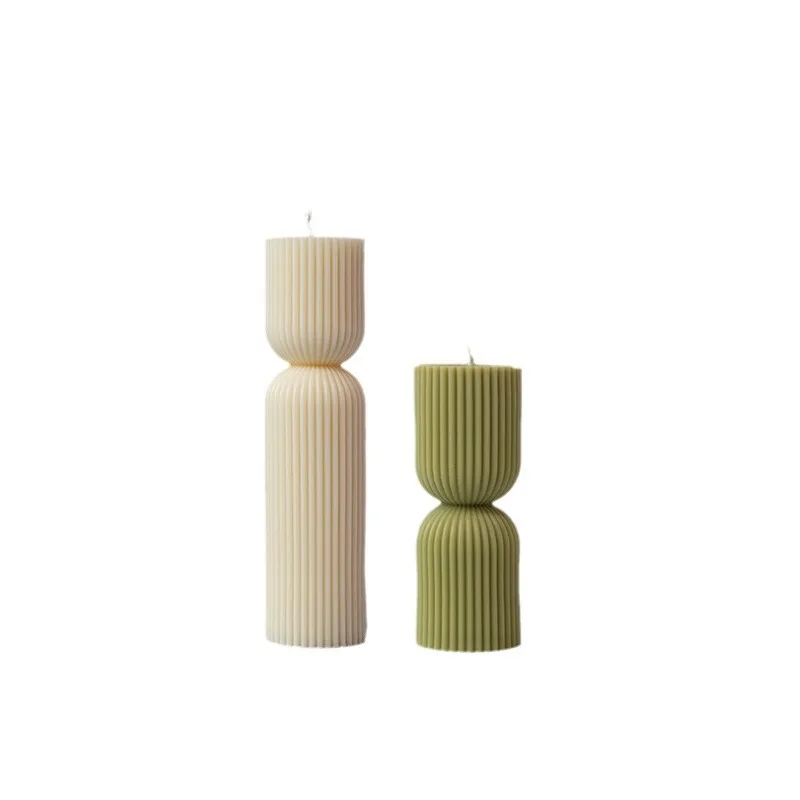 Handmade scented candles with striped columns. White and green decoration. Blue wind chimes scented candles accompanied the cere