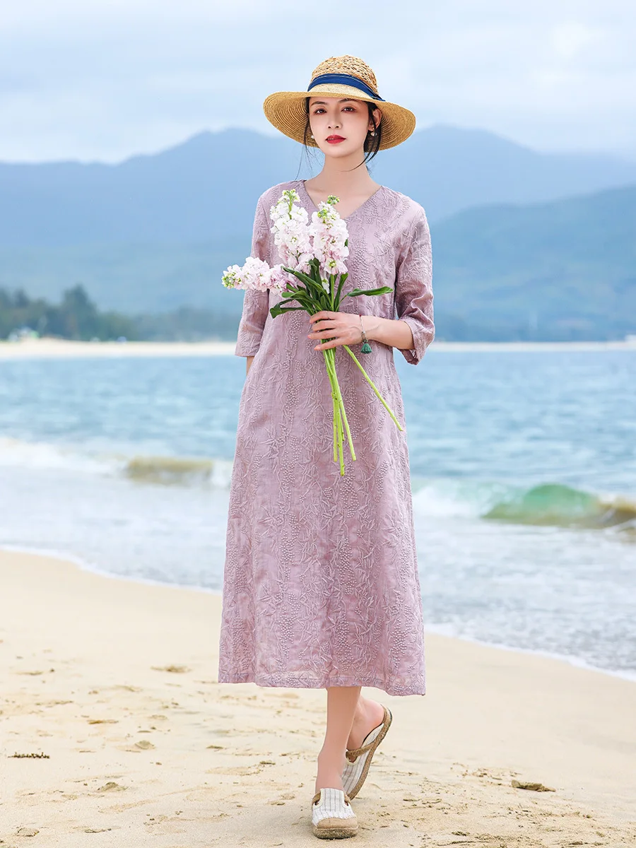 

Wearable art. This elegant V-neck ramie dress features intricate embroidery & a relaxed A-line cut for effortless boho chic.