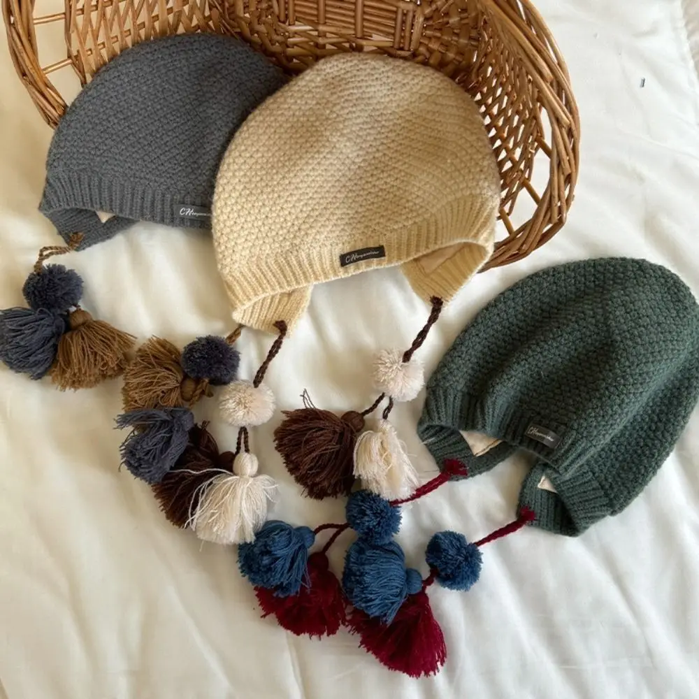 Gorro con borlas de estilo étnico para niños, gorro coreano de ganchillo hecho a mano para otoño e invierno, protección cálida para los oídos, gorro tejido para niñas