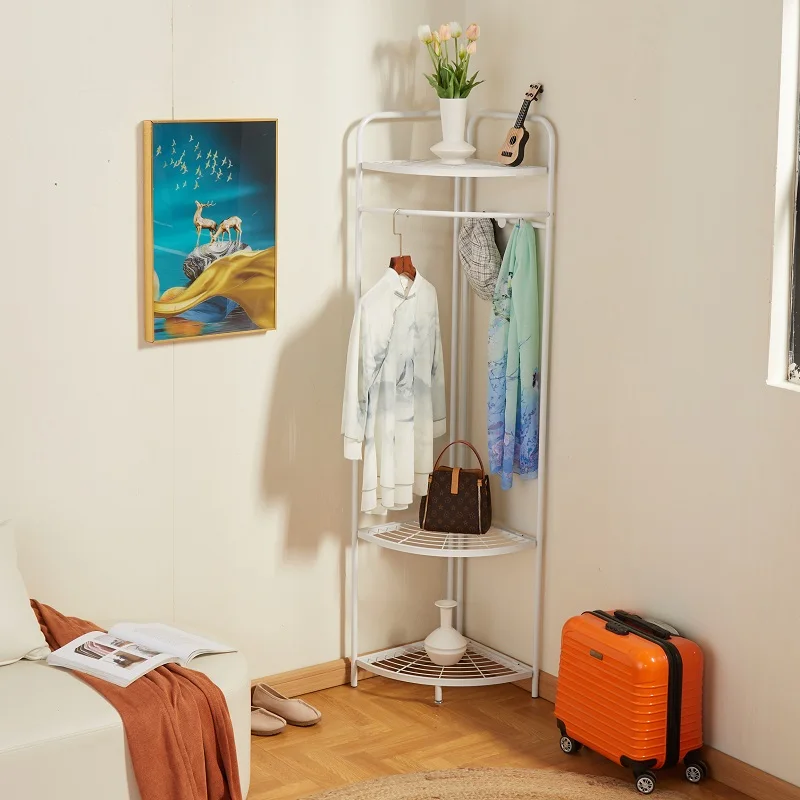 

Corner hangers, floor-to-ceiling hangers in the bedroom, vertical coat hangers, and clothes artifacts by the bed at night do not