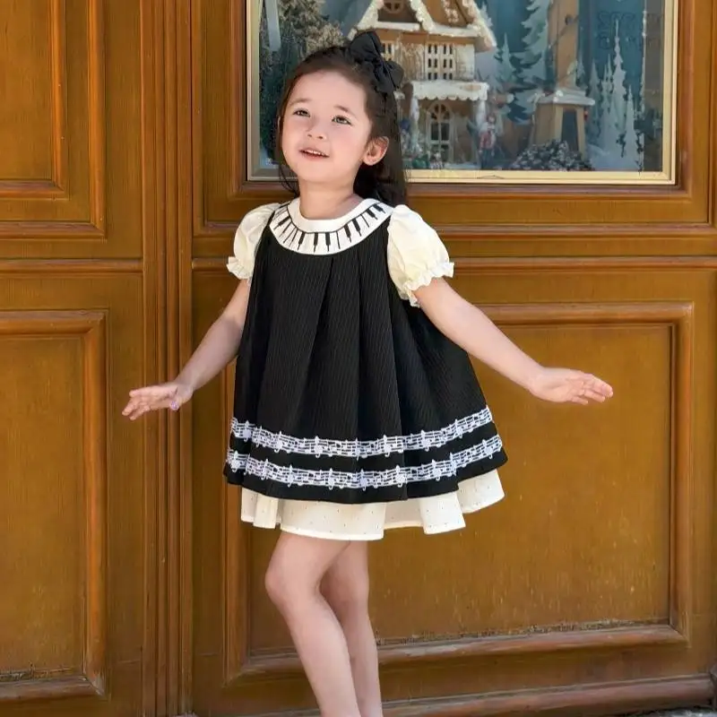 robe-de-danse-pour-tout-petits-noire-et-blanche-a-manches-bouffantes-a-deux-couches-avec-motif-de-notes-de-musique-pour-filles-pour-spectacle-musical-photographie
