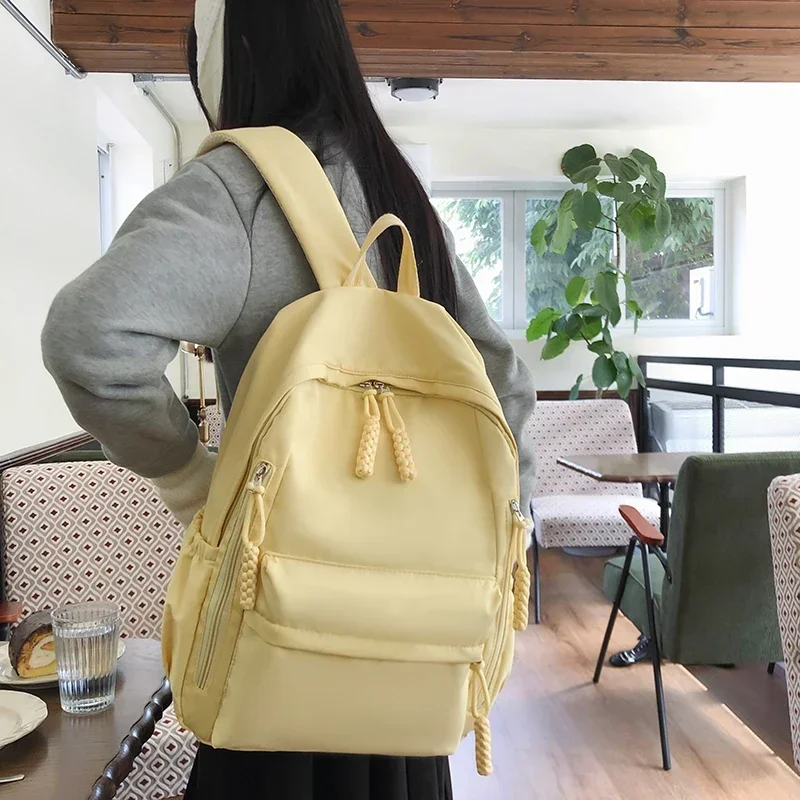 Bolsa de escola de nylon simples com zíper sólido de alta capacidade Mochilas de moda para meninos e meninas, linha de costura, 2024