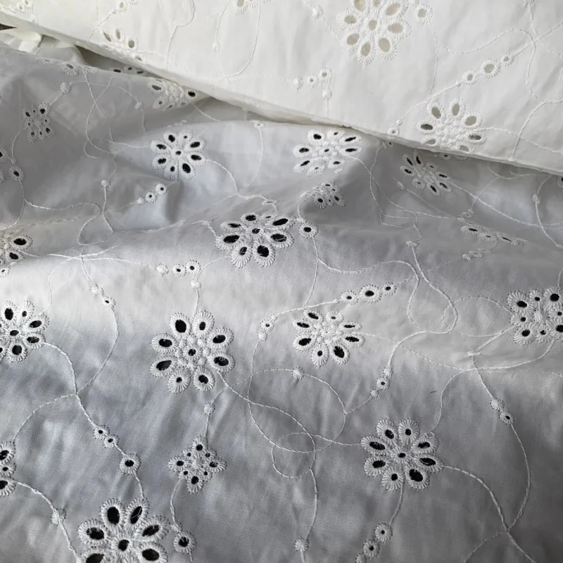 

High-end custom-made pearl-white openwork embroidered fabric dress, top garment, robe fabric for sale