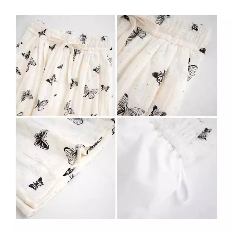 Nuovi pantaloni a gamba larga a farfalla in stile cinese Pantaloni a gamba dritta bianchi larghi e pigri a vita alta di nuovo stile estivo femminile con fori