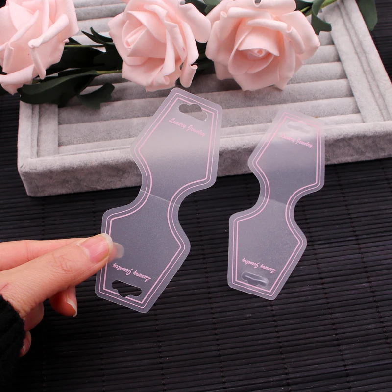 

50pcs 4.5x10.8cm Foldable Plastic Display Jewelry Cards Packing for Necklace Bracelet Pink PVC Headband Hairband Hanging Card