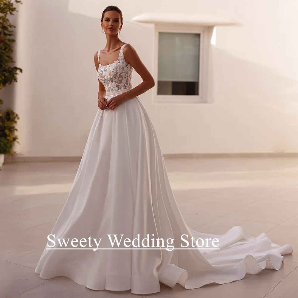 فستان زفاف ساحر مخصص برقبة مربعة بدون أكمام شفاف من خلال ذيل محكمة مزخرف على شكل حرف A فستان زفاف نسائي للعروس