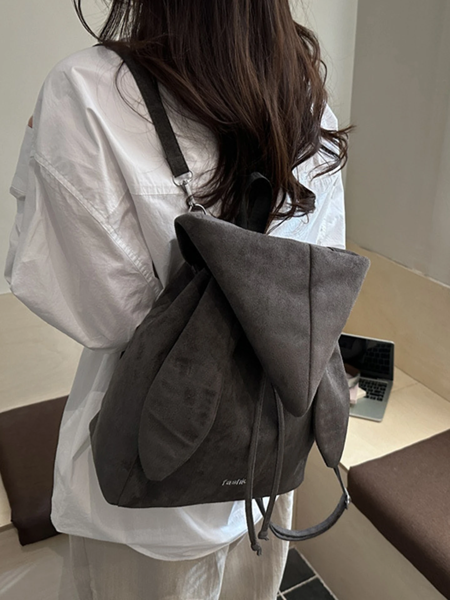 2026 New Angel Wings Backpack Simple High Value Drawstring Hoodie Cap Bag Small  Style Youth Casual Commuter Bag
