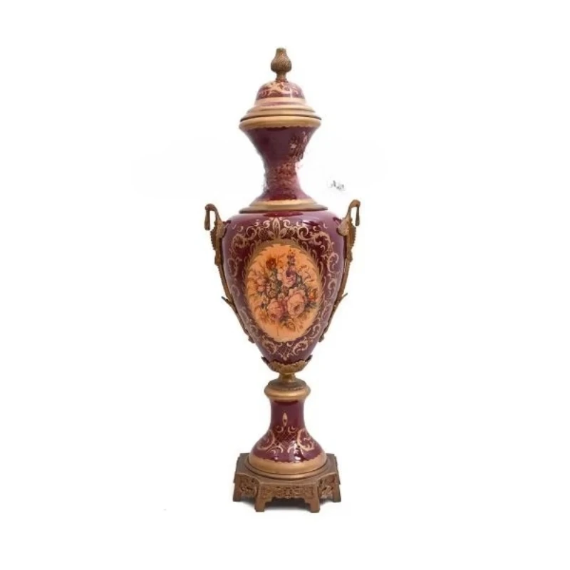 

Antique brass and porcelain adorned vase with ornate details of Burgundy floral paintings