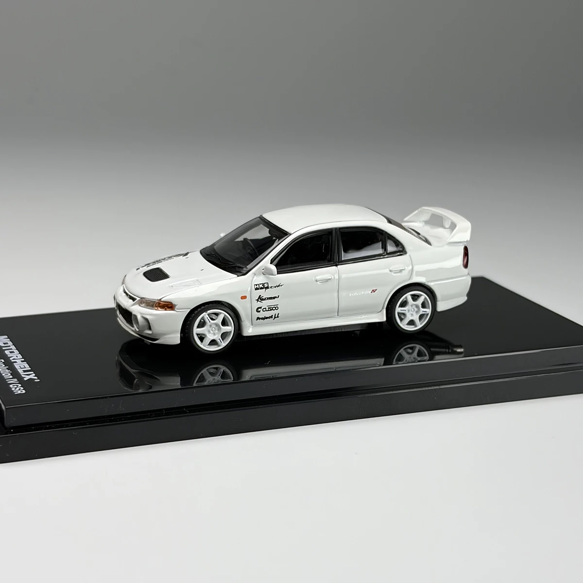 Modèle de voiture miniature en alliage moulé sous pression Mitsubishi EVO4 Lancer Evolution IV GSR à l'échelle 1:64, jouets classiques, cadeaux pour adultes, souvenir, exposition statique