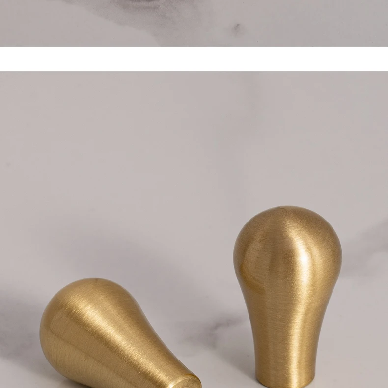 Brushed brass cupboard pull and teardrop knob shown in the supplier product illustration 23