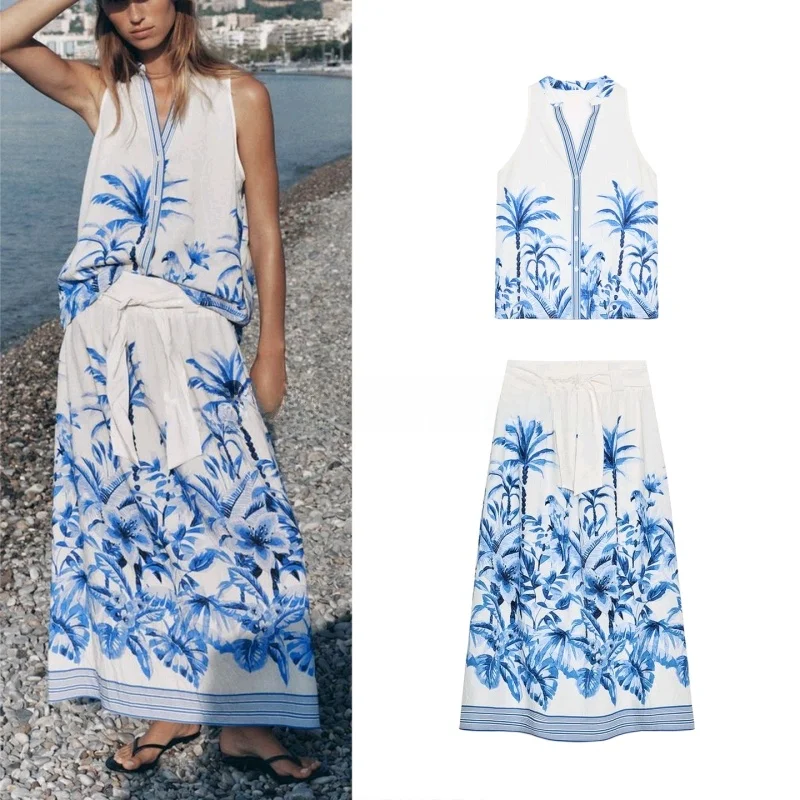 

Летний комплект 2025: юбка миди с V-образным вырезом и тропическим цветочным принтом, а также длинные брюки или рубашка на пуговицах.