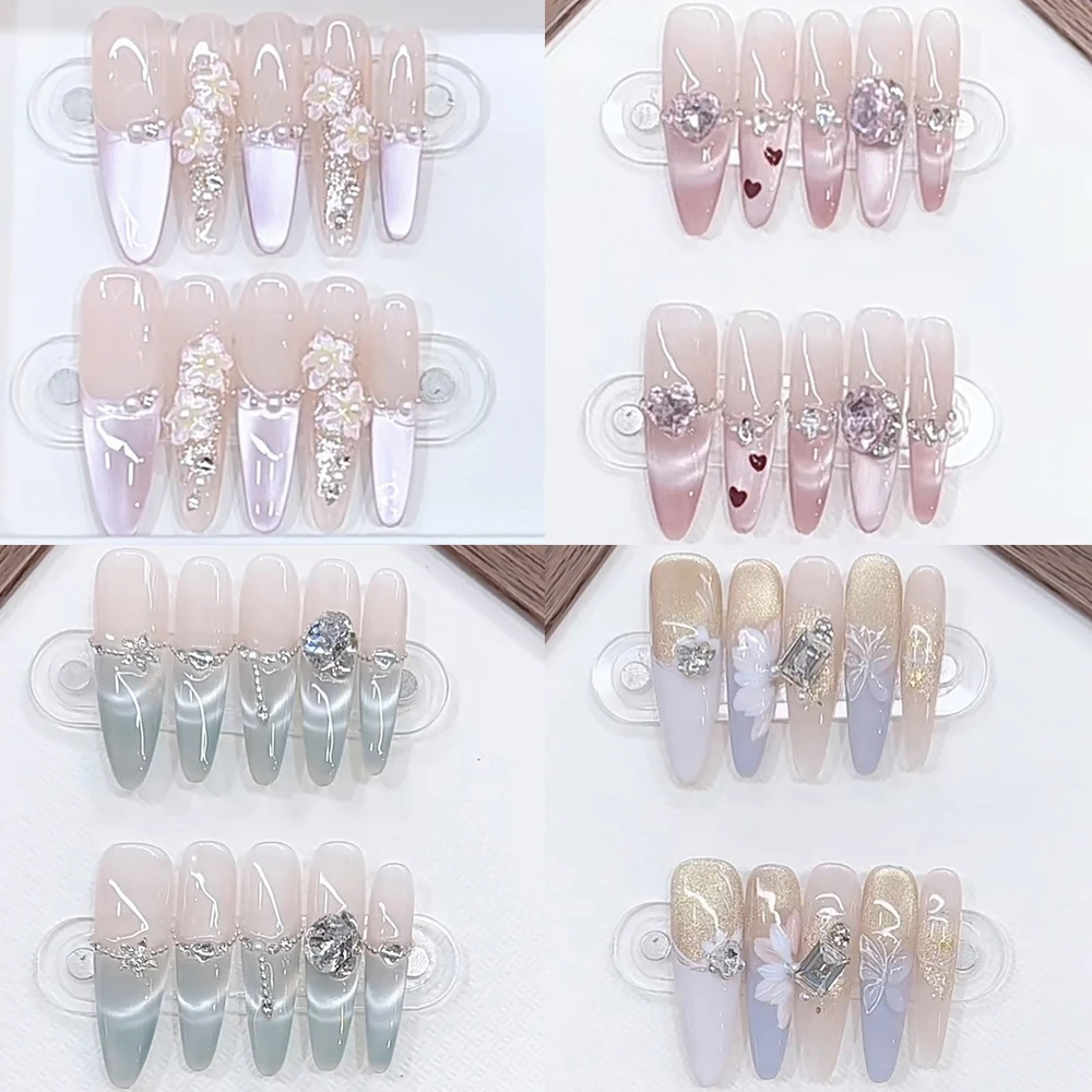 

Милые милые блестящие французские ногти со стразами, кошачьи глаза, жемчужные бабочки, носимые длинные труны на шпильке, эллипс, накладные ногти