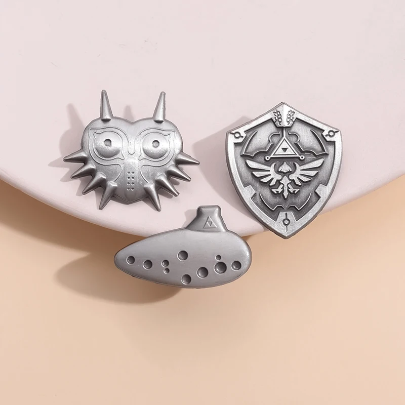 Majoras Mask Enamel Pin Hylian Shield Brooches Badges Custom Adventure Games Jewelry For Fan Friends Wholesale