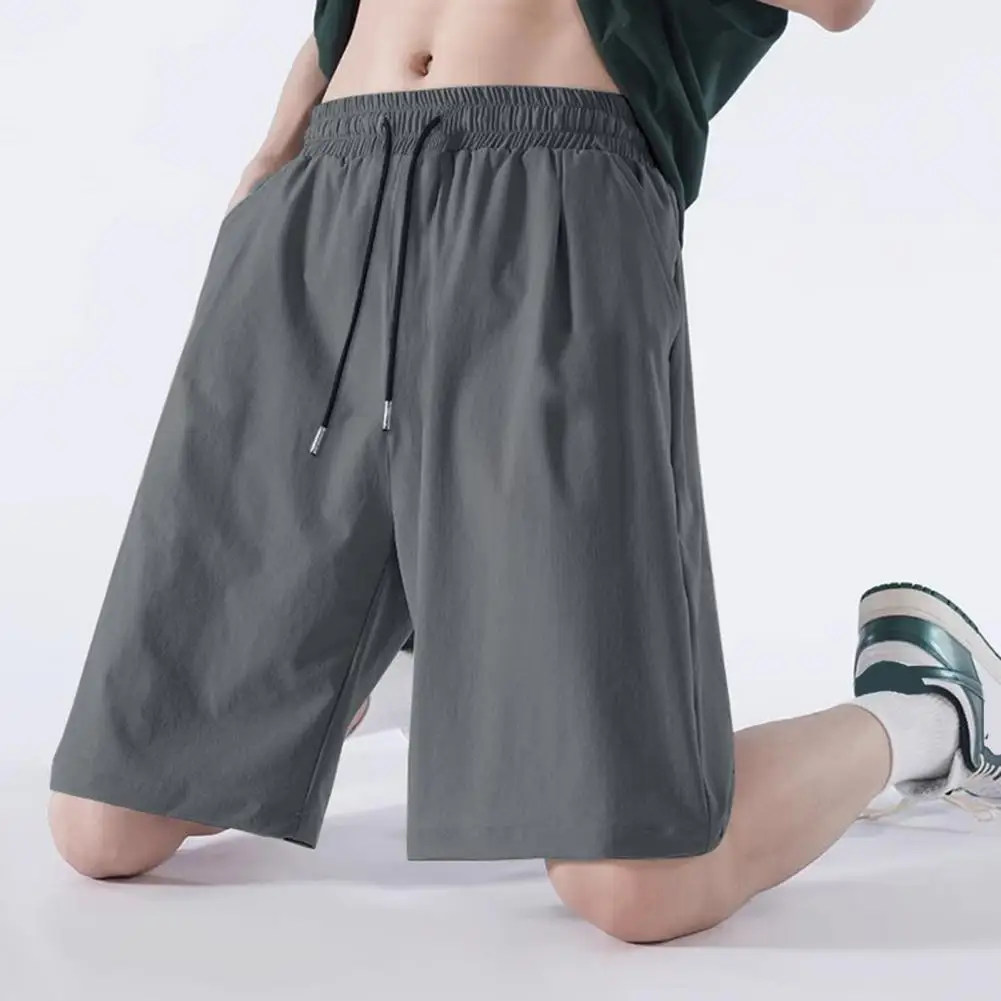 Pantalones cortos deportivos finos para hombre, pantalones cortos holgados de pierna recta, frescos, transpirables, nueva tendencia de moda, deportes informales con bolsillo sólido