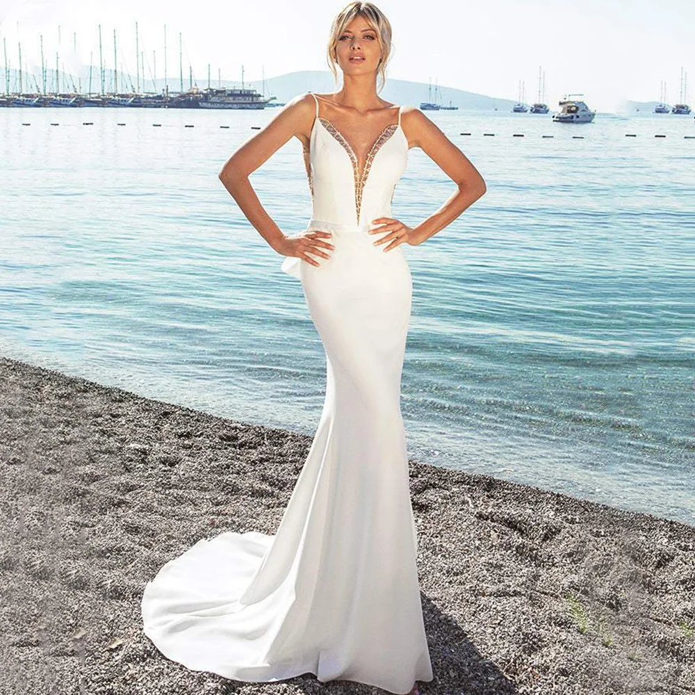 Charming Spaghetti Straps Seaside Wedding Dress Sexy Backless Mermaid Floor Length with Belt and Bow Sleeveless Bridal Gowns