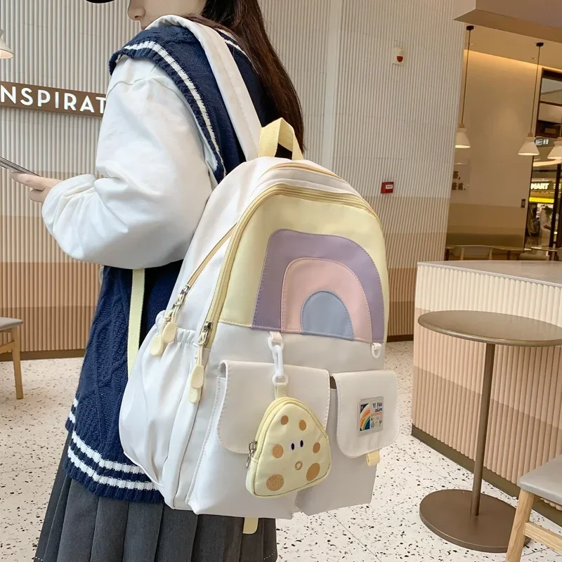 Mochila escolar colorida para estudiantes escolares femeninas, mochila escolar japonesa Simple de gran capacidad con corte de arcoíris y colgante de monedero de queso