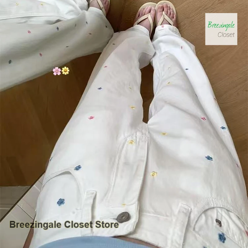 

Korean style white floral embroidery straight jeans women's spring and autumn plus size slim fashion wide-leg casual mop pants.
