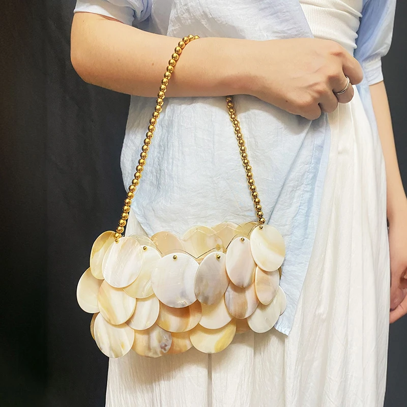 

2025 New Summer Fashionable Vacation Style Sweet Wind Beach Fritillaria Round Disc High end Niche Shoulder Bag