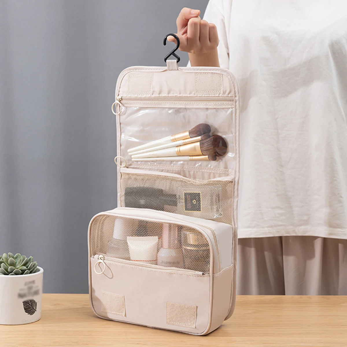 A multi-functional travel bag that can be hung with dry and wet separation, a hand-held toiletry and storage bag, one set