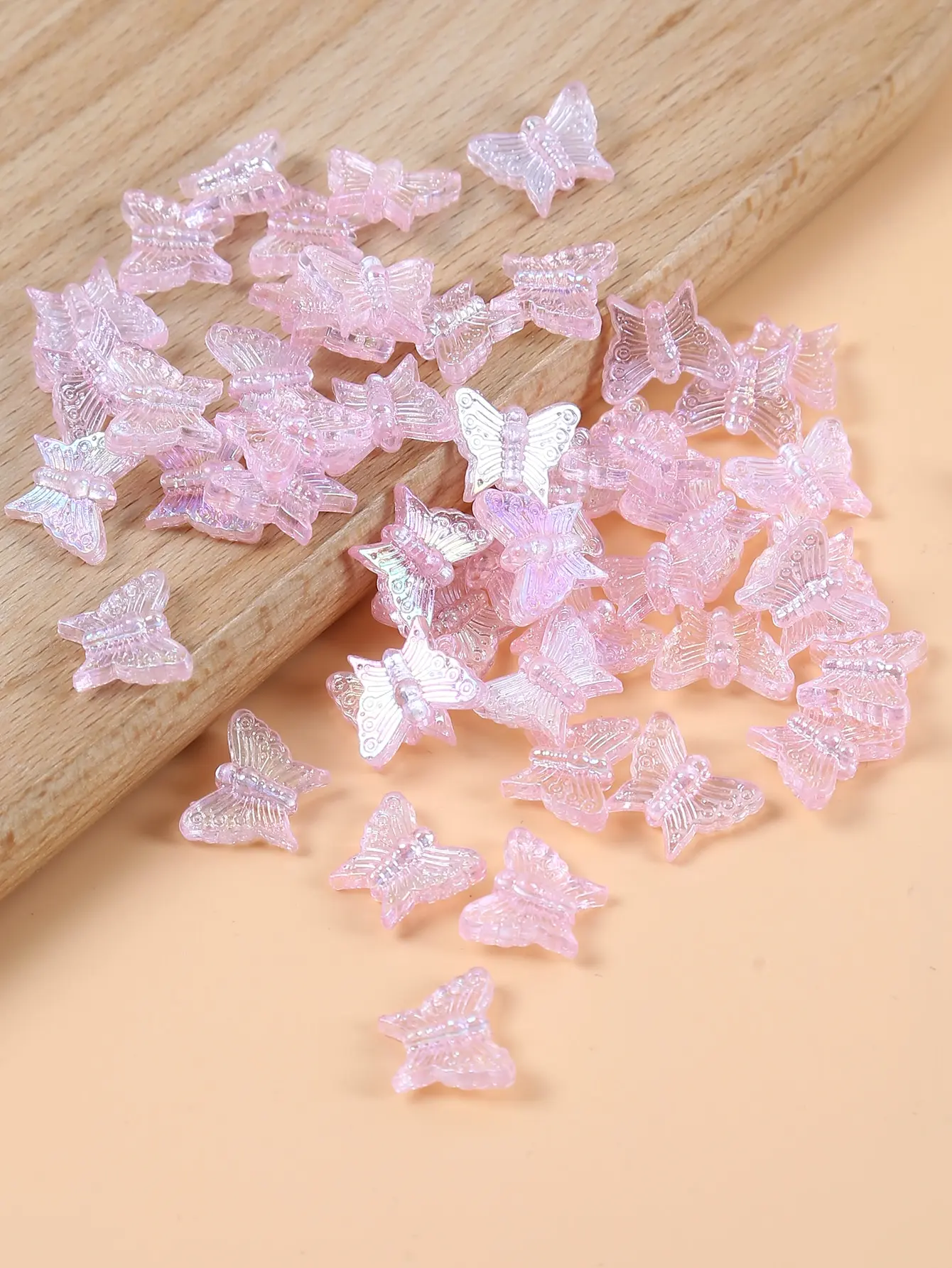 50 pink butterfly beads for handcrafting