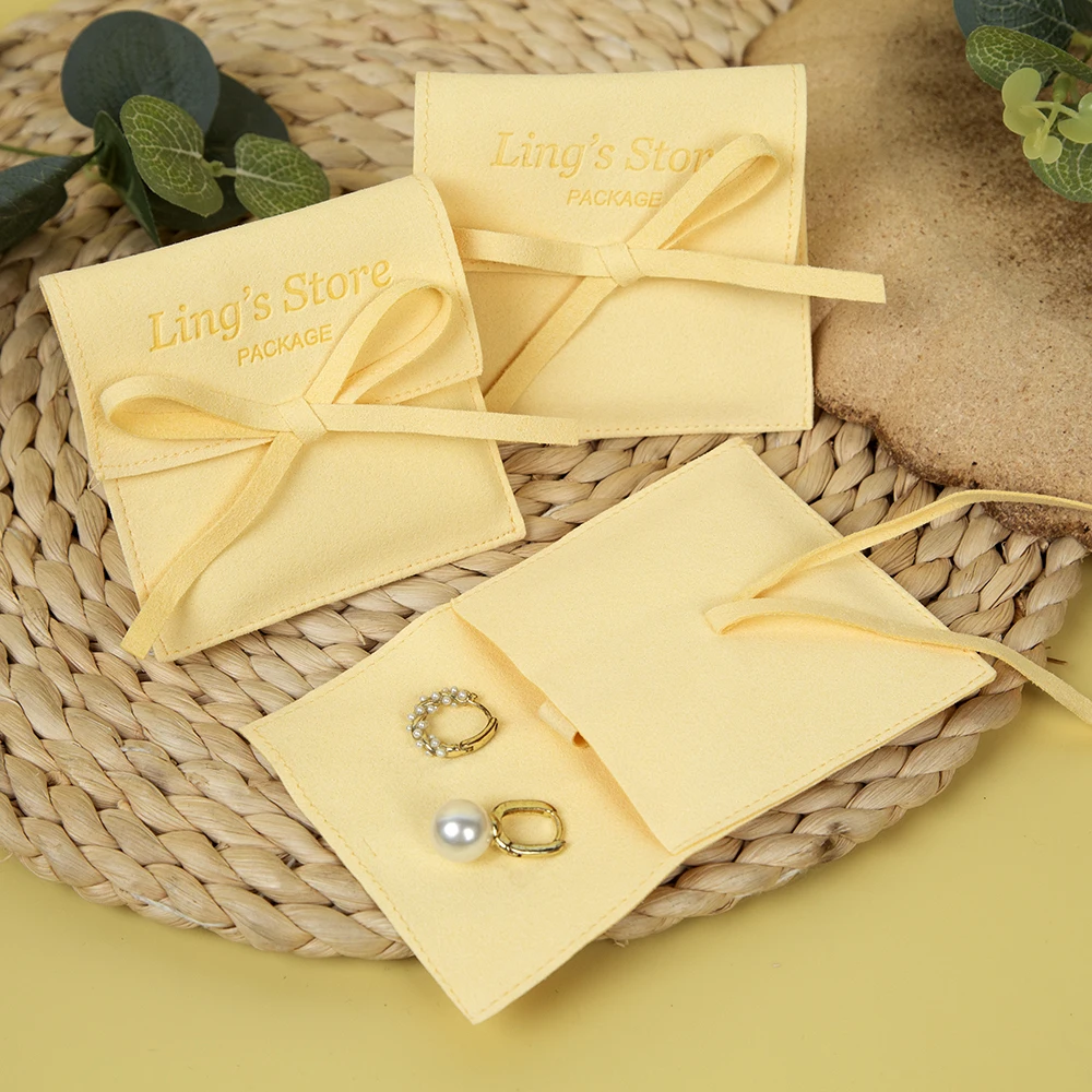 

50Pcs Custom Logo Jewelry Microfiber Bag Yellow Bowknot Pouch Small Gift Packaging Rings Earrings Necklace Pendant Necklace Sack
