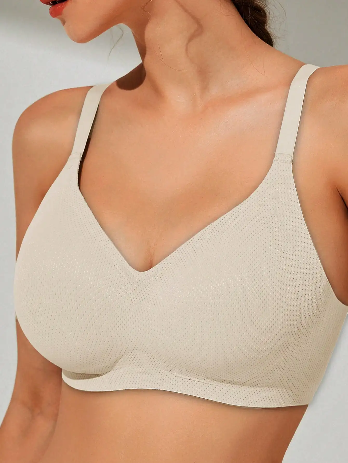 Large size seamless and underwire bra for women featuring a large chest and a small cinched accessory breast for soft support