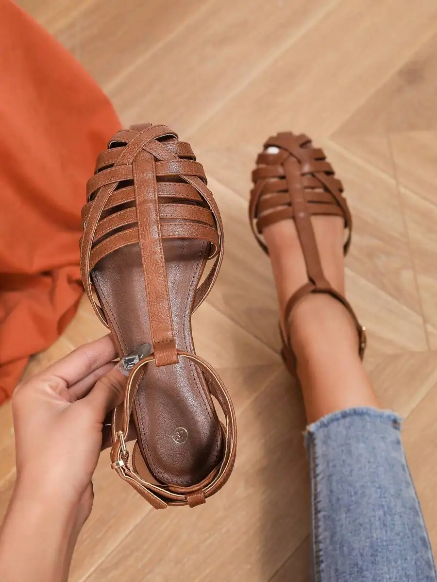 

Womens Brown Flat Sandals With Hollow-Out Roman Style T-Strap And Ankle Strap
