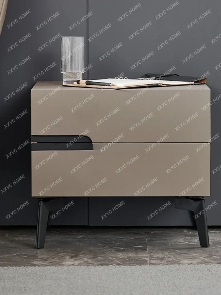 A  Italian light luxury bedroom bedside table with modern minimalist bare leather solid wood minimalist and narrow