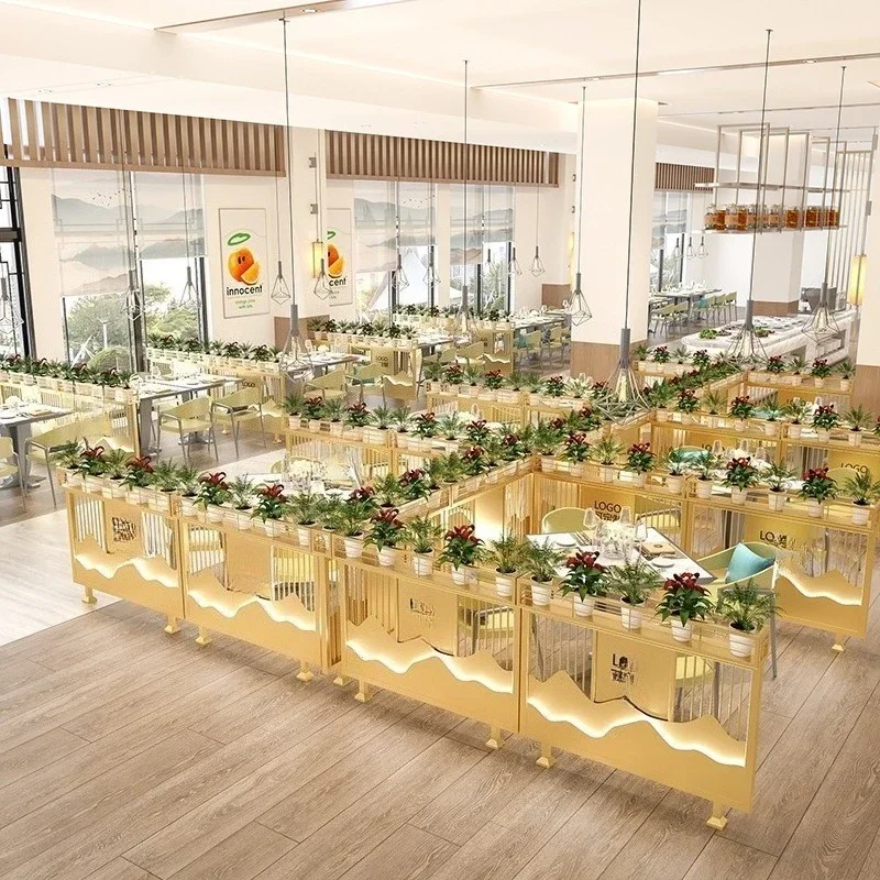 Modern Chinese restaurant low partition bar booth low wrought iron screen fence aisle green plant flower stand decorative