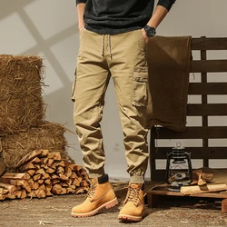 Calça casual masculina com cordão, bolsos esportivos estilo safari, roupas masculinas emendadas, cor sólida, calças soltas, vintage, primavera, outono, 2024