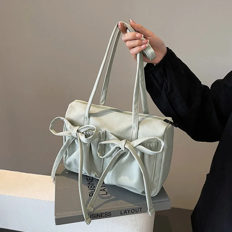 2024 neue koreanische Schleife Nylon Umhängetasche modische und süße Design Einkaufstasche gefaltet große Kapazität Pendler Damen handtasche