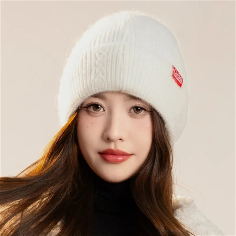 Women's autumn/winter knitted hat. Simple, warm, ear protectors. Solid-color all-match, plain face cold hat and pullover.