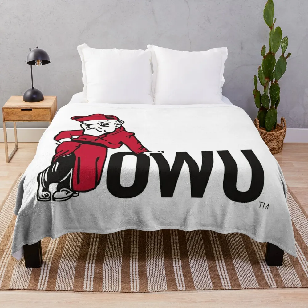 Ohio Wesleyan battling bishops Throw Blanket Furrys Plaid on the sofa wednesday Blankets