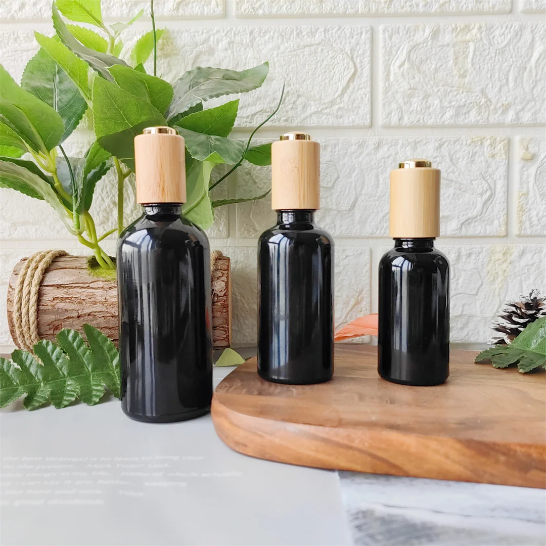 Empty 5ml 10ml 15ml 20ml 30ml 50ml 100ml Cosmetic Essential Hair Oils Bottles Black Glass Dropper Bottle With Bamboo Lids Top