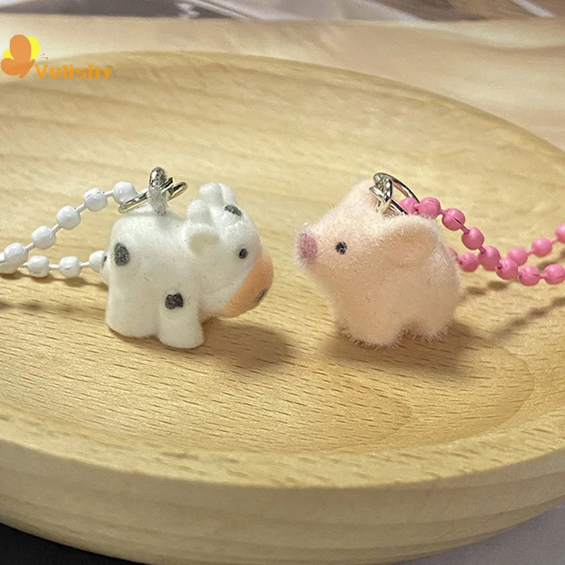 ثلاثية الأبعاد يتدفقون الحيوان سلسلة مفاتيح قصيرة صغيرة الراتنج رقيق كيرينغ حقيبة أنيقة قلادة حقيبة سماعة الاذن سحر حامل مفتاح السيارة زوجين الهدايا