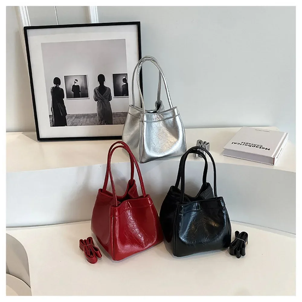 

Silver bucket bag for women new fashionable and simple lunch box bag, niche western-style texture hand-held small bag