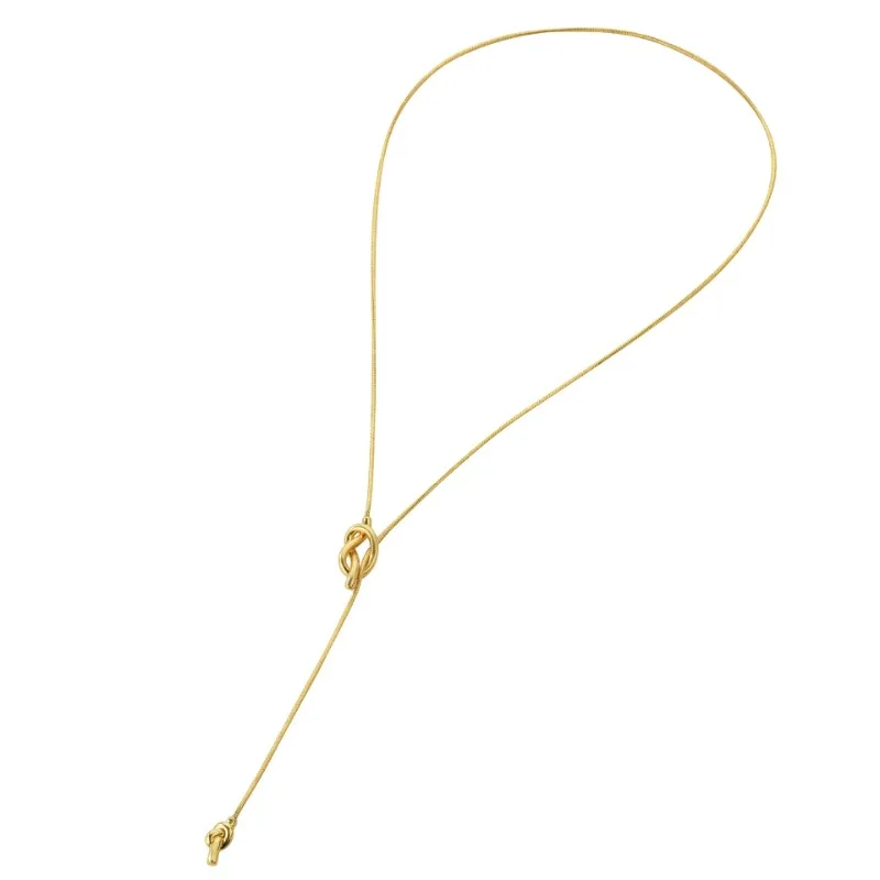 

2025 A lady with a vintage gold long sailor knot multi-functional sweater chain necklace accessory