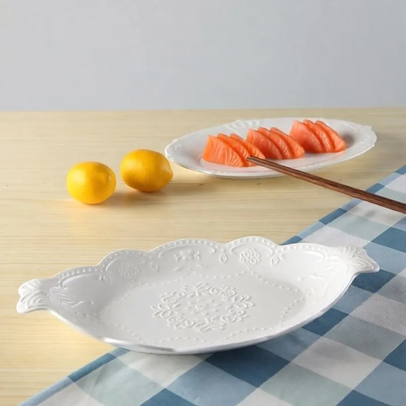 White embossed porcelain oval fish plate, ceramic pasta borden, serving tray, plate dessert kitchen, palace restaurant serving