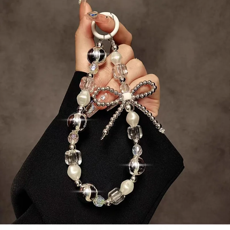 

Silver bow mobile phone lanyard handmade beads crystal beads mobile phone case chain wrist short URL with transparent patch