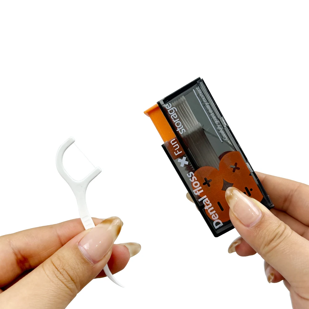 Uma caixa de fio dental portátil que aparece automaticamente o fio dental usado para odontologia de tubo de linha removível em cuidados bucais.