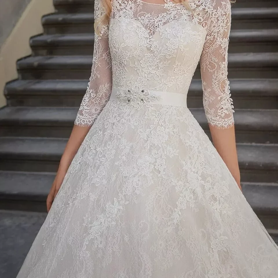 Abiti da sposa eleganti in pizzo a trapezio con scollo a O e maniche lunghe con applicazioni Abito da sposa avorio personalizzato