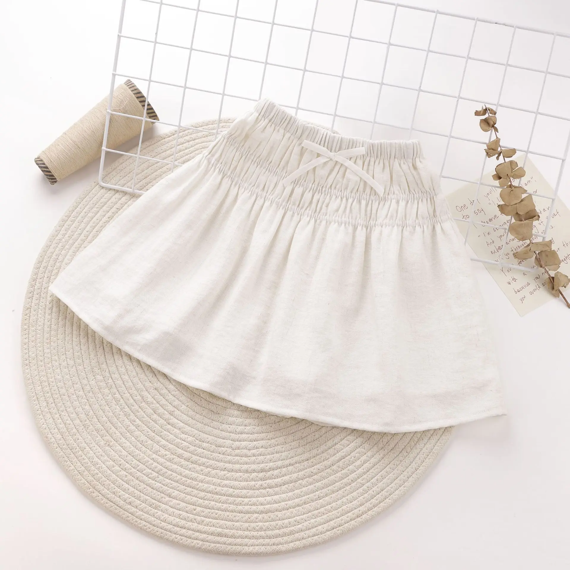 تنورة كورية متعددة الاستخدامات قابلة للتنفس وخفيفة الوزن للأطفال البنات تنورة ميدي من نسيج القطن والكتان مع فيونكة جديدة ولطيفة