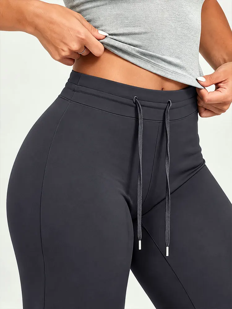 Pantalones de cintura alta con cordón ajustable y pernera ancha, ideales para yoga y actividades deportivas, con efecto reductor en la zona abdominal y realce de glúteos. Pantalones deportivos y casuales para mujer.