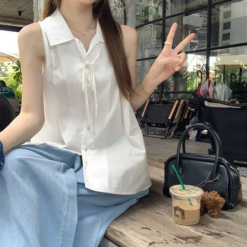 Camisa blanca básica sin mangas para mujer, blusas con cordones a la moda coreana con botones y cuello vuelto, blusas holgadas informales de verano