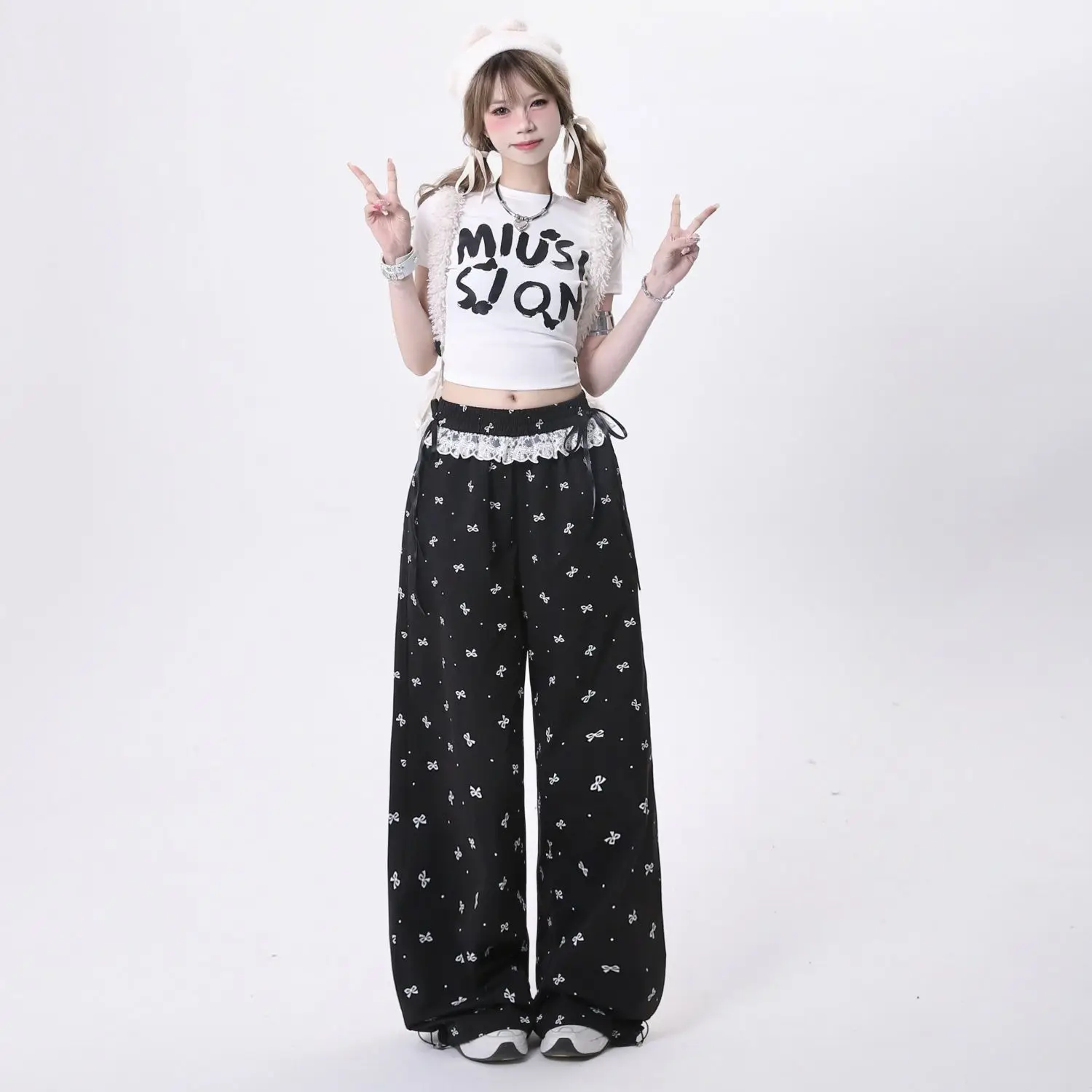 Damskie spodnie z kokardką ze słodką koronką koreańskie Retro Casual modne spodnie patchworkowy wzór letni luźny elastyczny pas prosta nogawka