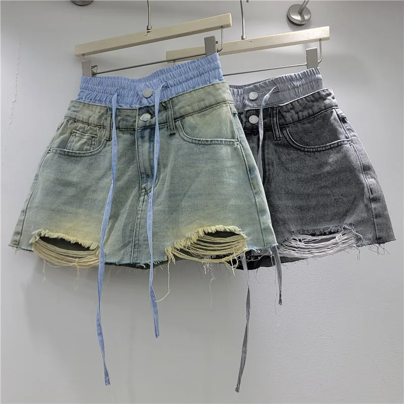 

2026 Summer Retro Niche Style High Waist Contrast Color Patchwork Asymmetrical Raw Edge Denim Skirt Pants for Women