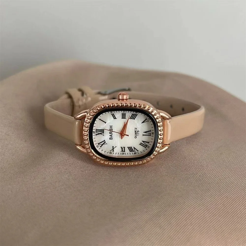 ساعة نسائية بسيطة رفيعة بحزام جلدي موضة بيضاوية بمينا روماني ساعات كوارتز للنساء ساعات يد فاخرة هدية للسيدات