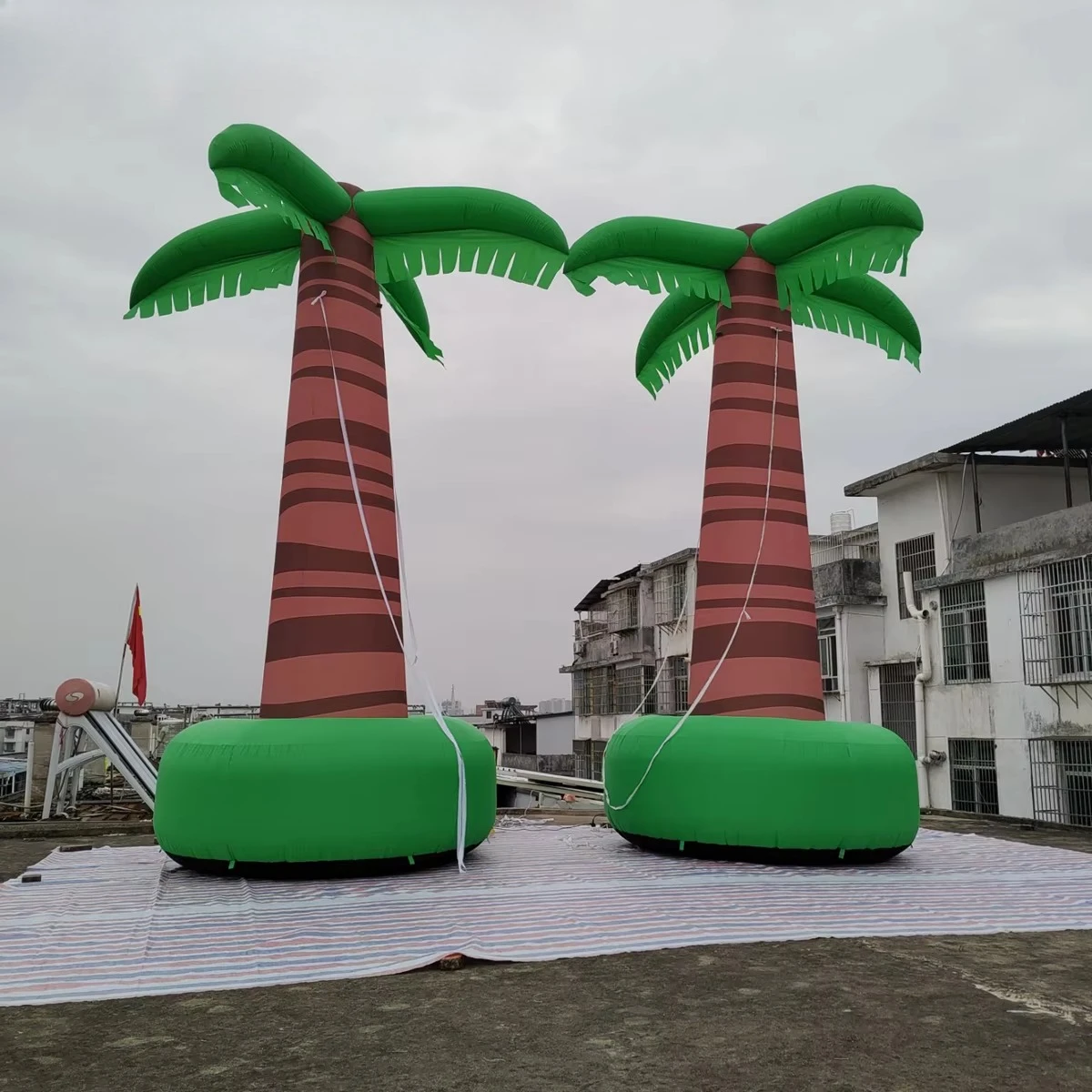 Giant inflatable coconut trees, tall inflatable tropical trees for themed parties, beach events, and outdoor decorations